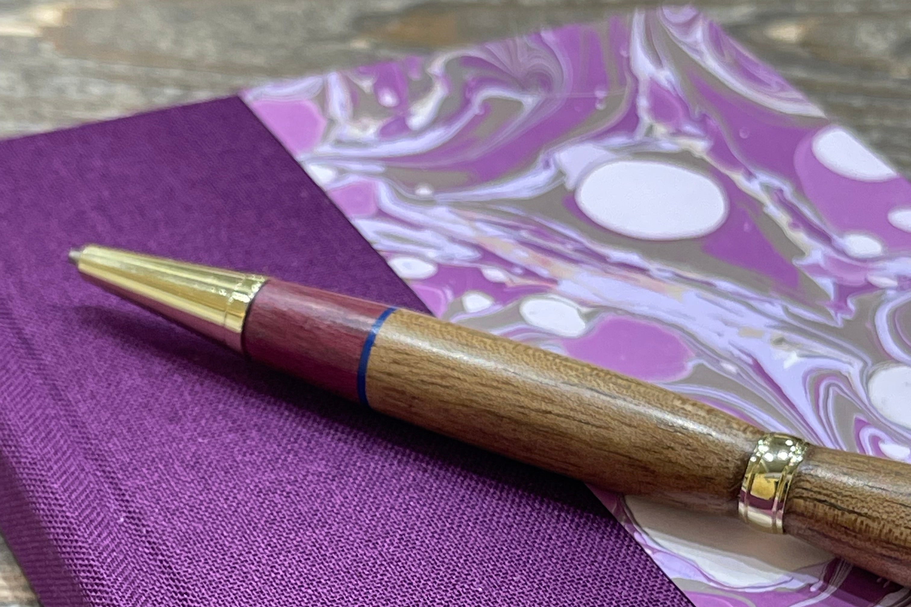 Hand marbled notebook with purple book cloth with wooden pen with gold accent