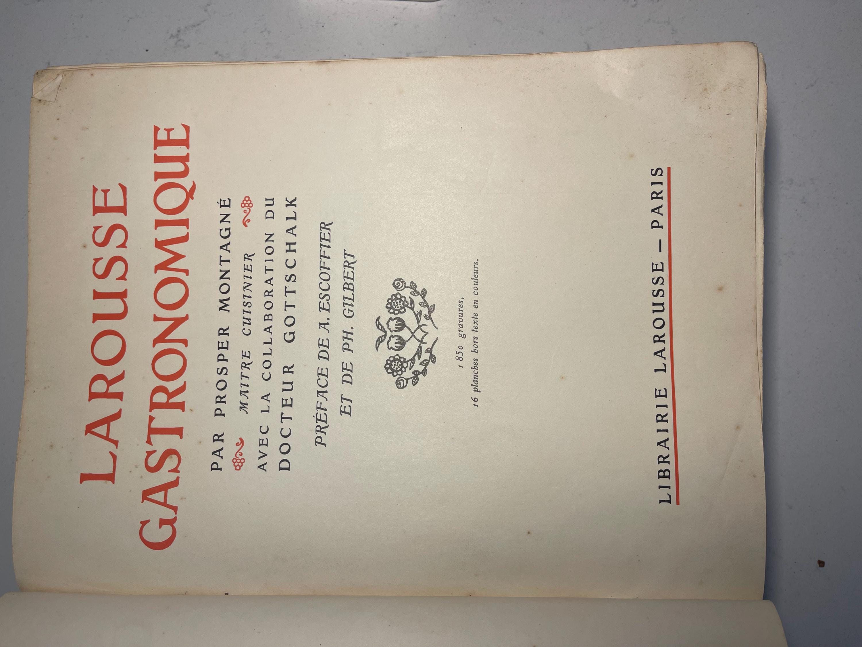 Larousse Gastronomique published in 1938 with leather spine and green marbled cover and end papers. Iconic piece of gastronomic history.