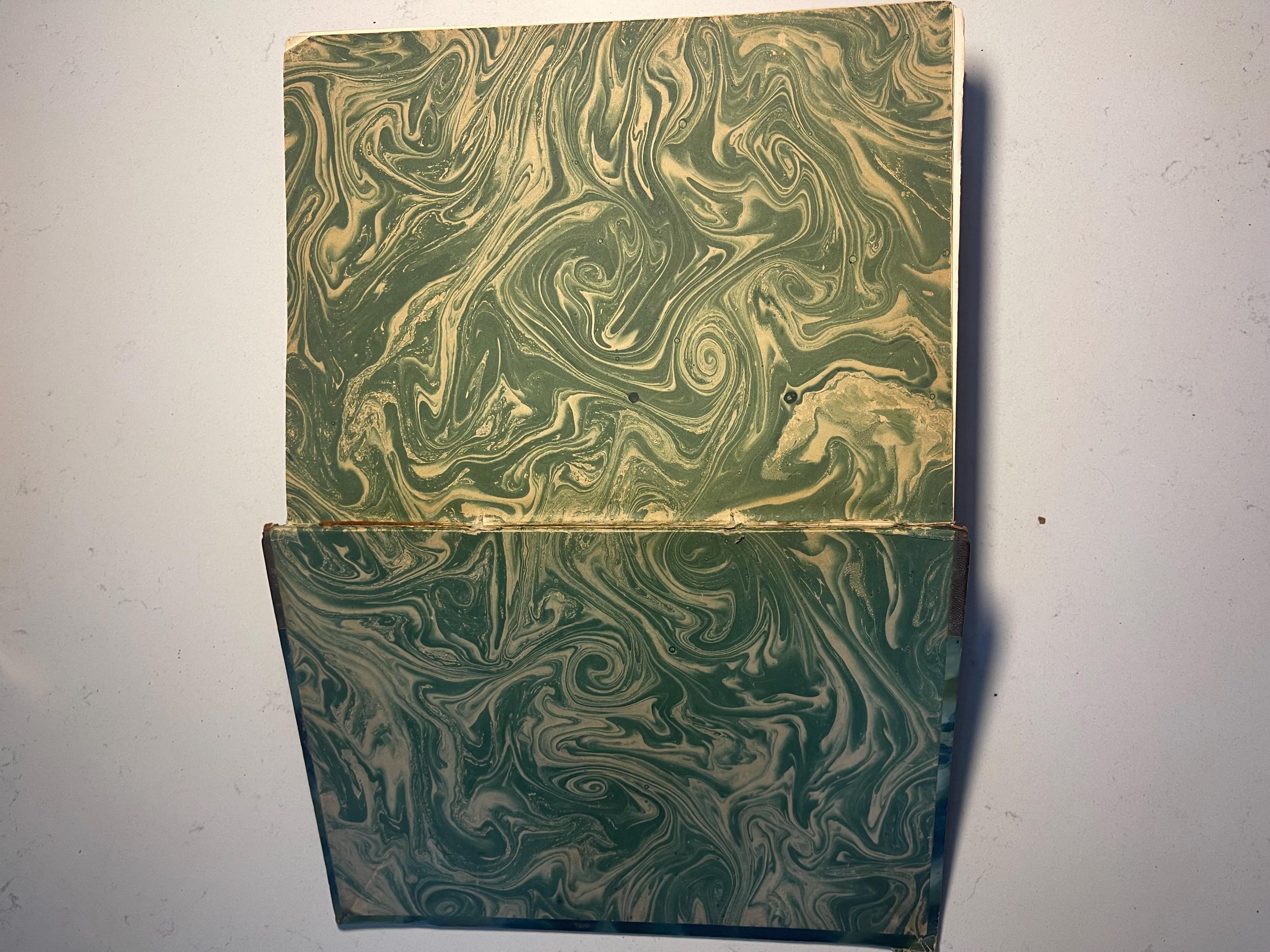 Larousse Gastronomique published in 1938 with leather spine and green marbled cover and end papers. Iconic piece of gastronomic history.