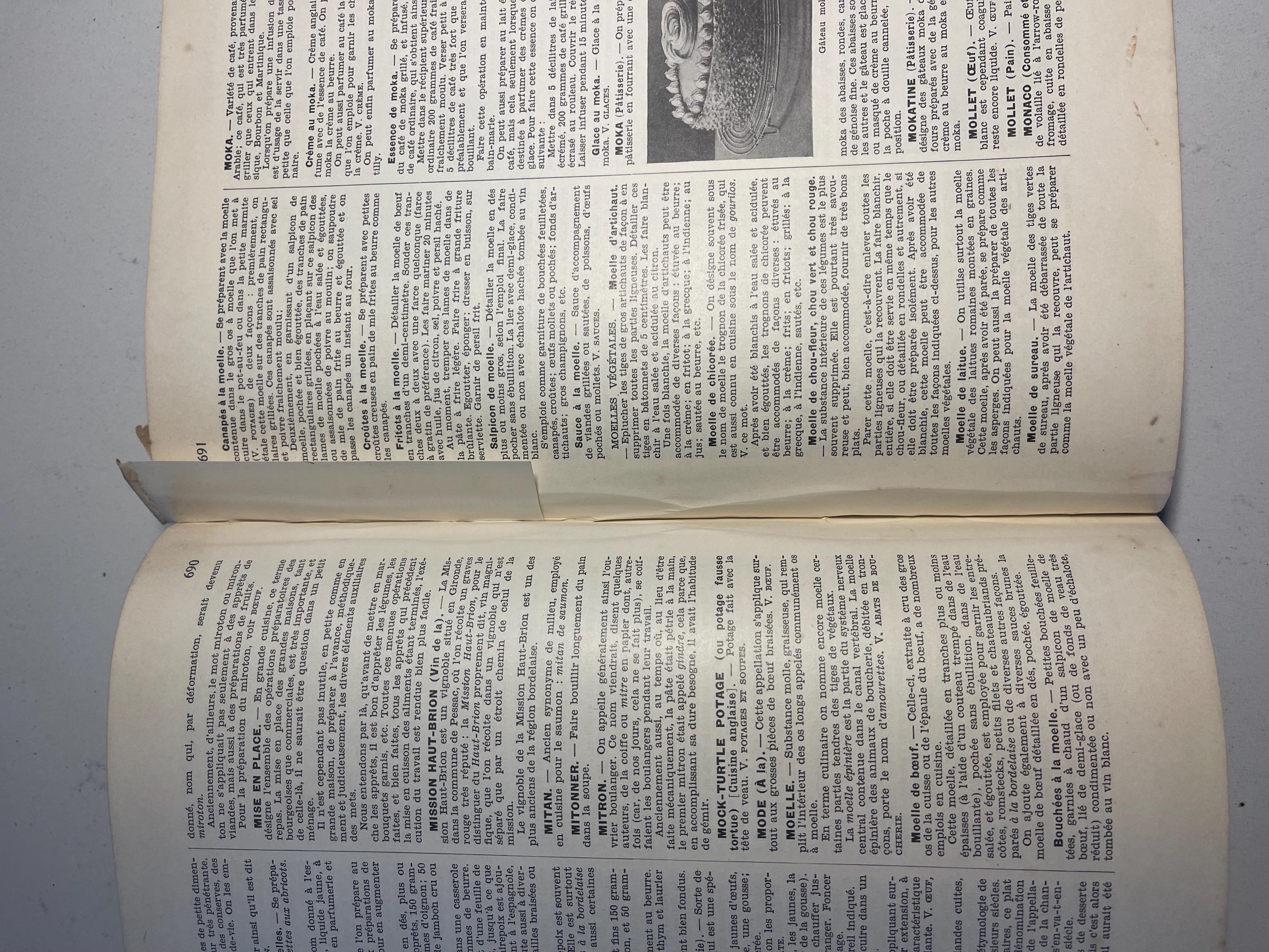 Larousse Gastronomique published in 1938 with leather spine and green marbled cover and end papers. Iconic piece of gastronomic history.