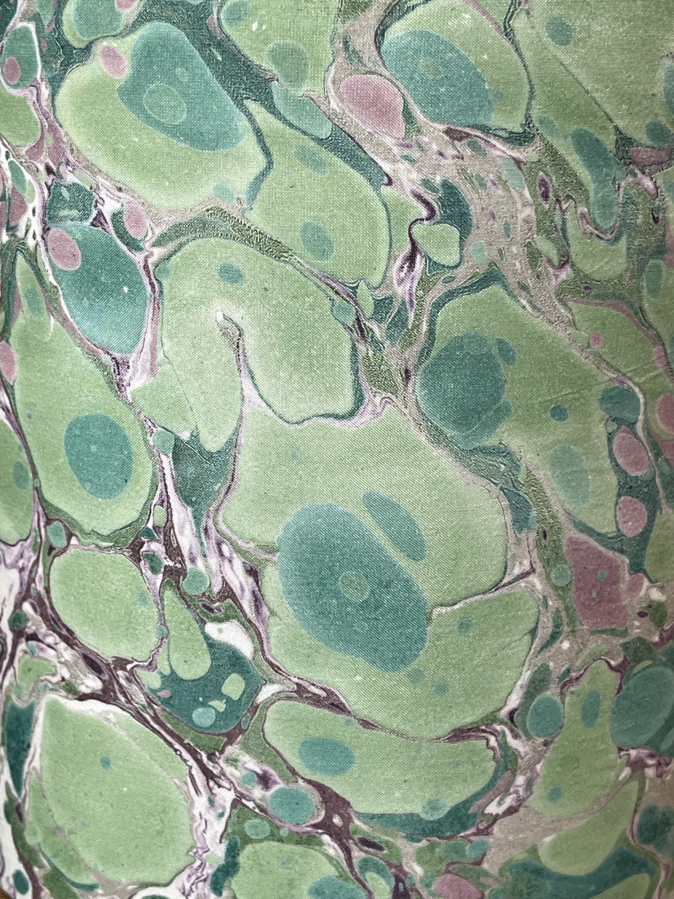 A pair of unique silk green and plum hand marbled drum table lampshades ideal as table or bedside lamps
