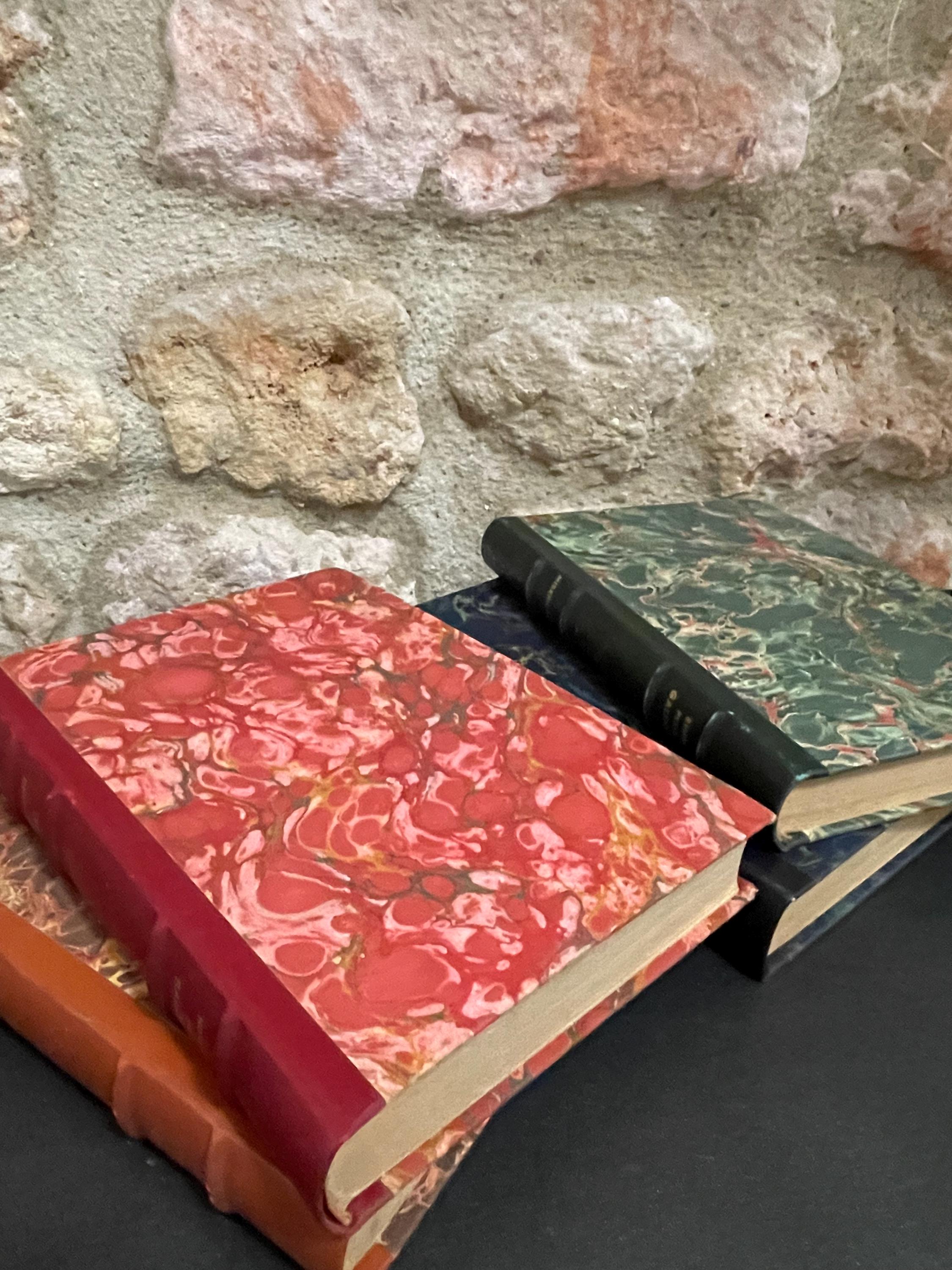 Collection of 4 colourful leather bound green, red, brown and blue marbled books from the mid 1950s France, ideal decorative pieces