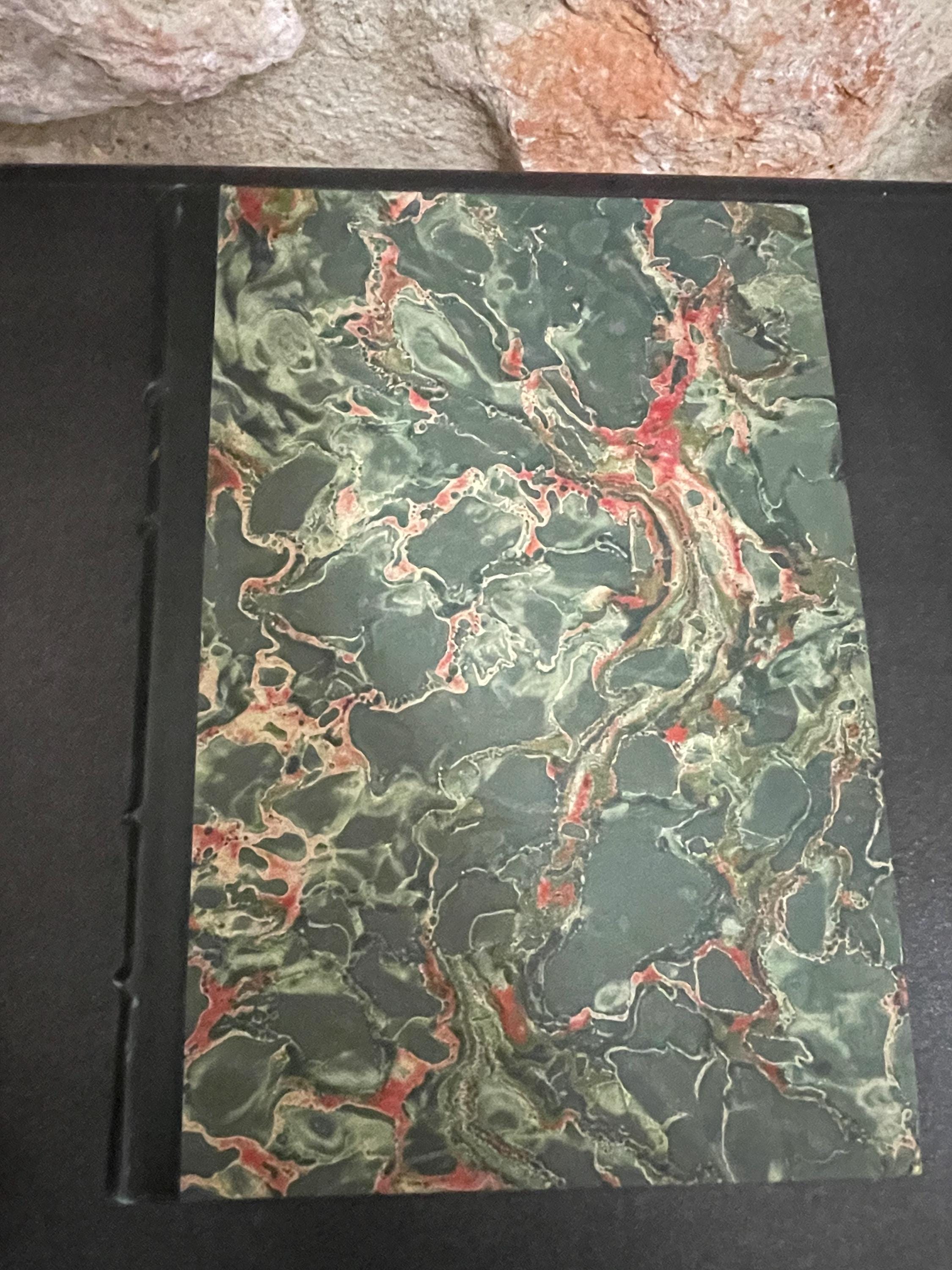 Collection of 4 colourful leather bound green, red, brown and blue marbled books from the mid 1950s France, ideal decorative pieces