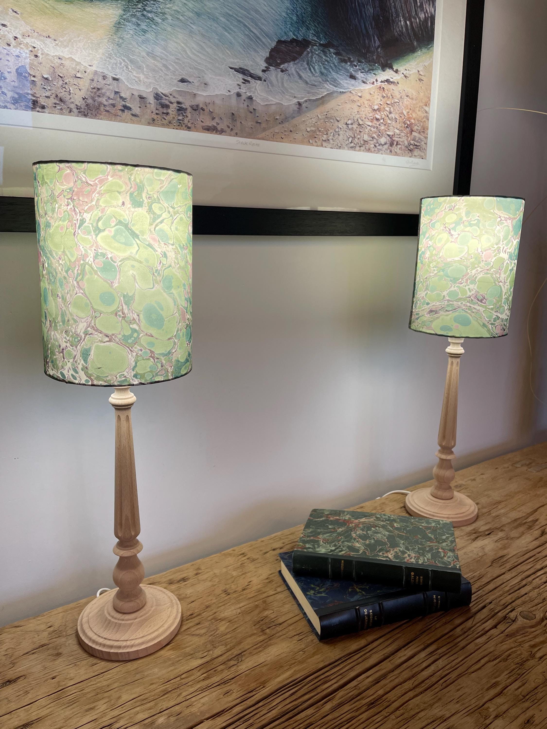 A pair of unique silk green and plum hand marbled drum table lampshades ideal as table or bedside lamps