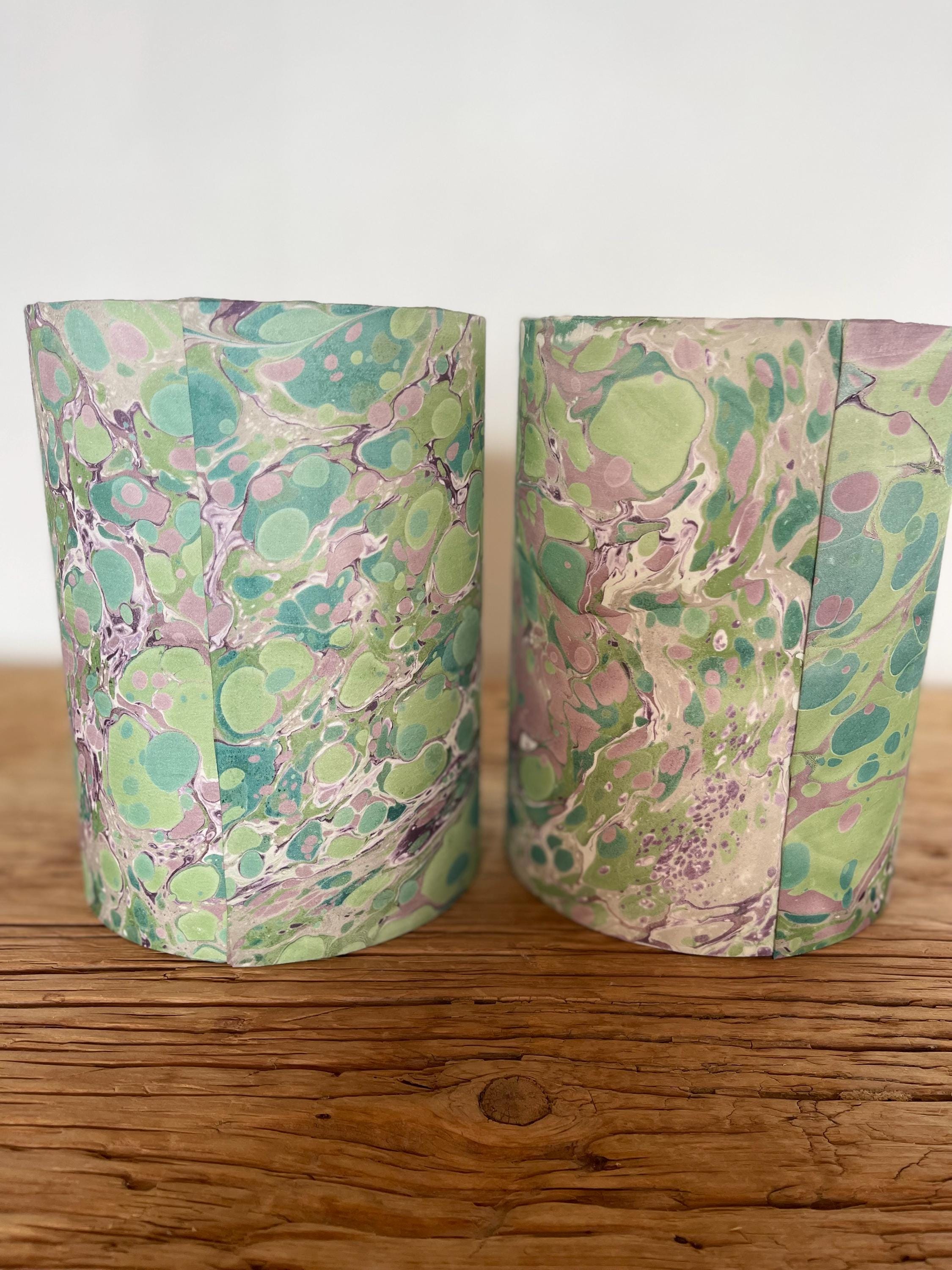 A pair of unique silk green and plum hand marbled drum table lampshades ideal as table or bedside lamps