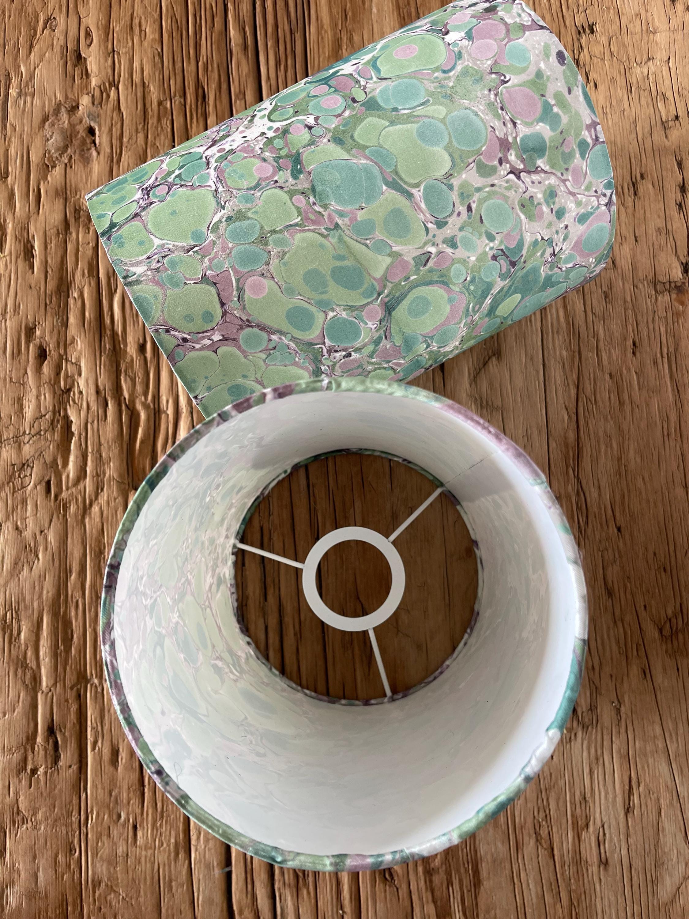 A pair of unique silk green and plum hand marbled drum table lampshades ideal as table or bedside lamps