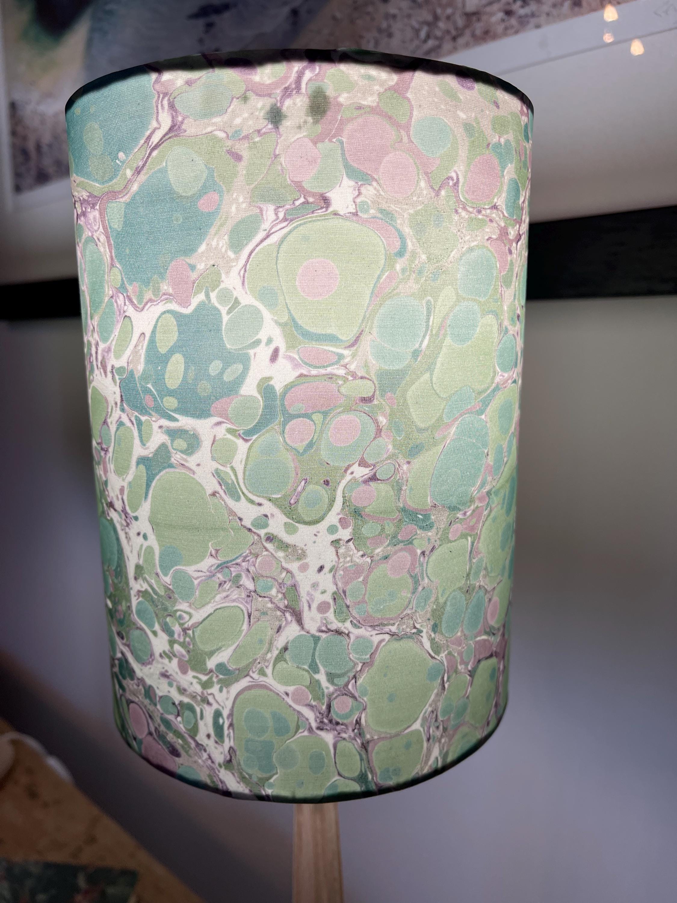 A pair of unique silk green and plum hand marbled drum table lampshades ideal as table or bedside lamps