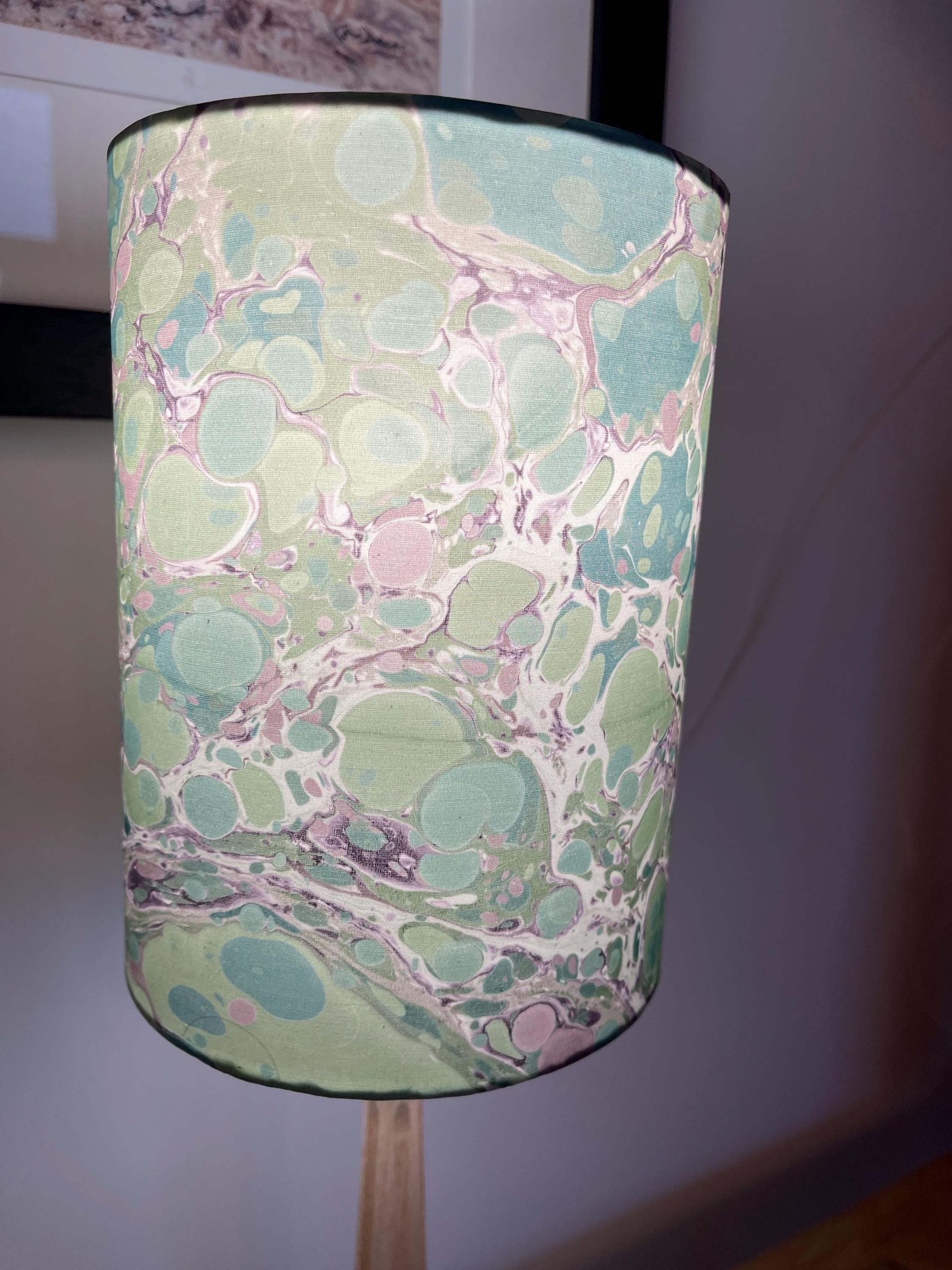 A pair of unique silk green and plum hand marbled drum table lampshades ideal as table or bedside lamps