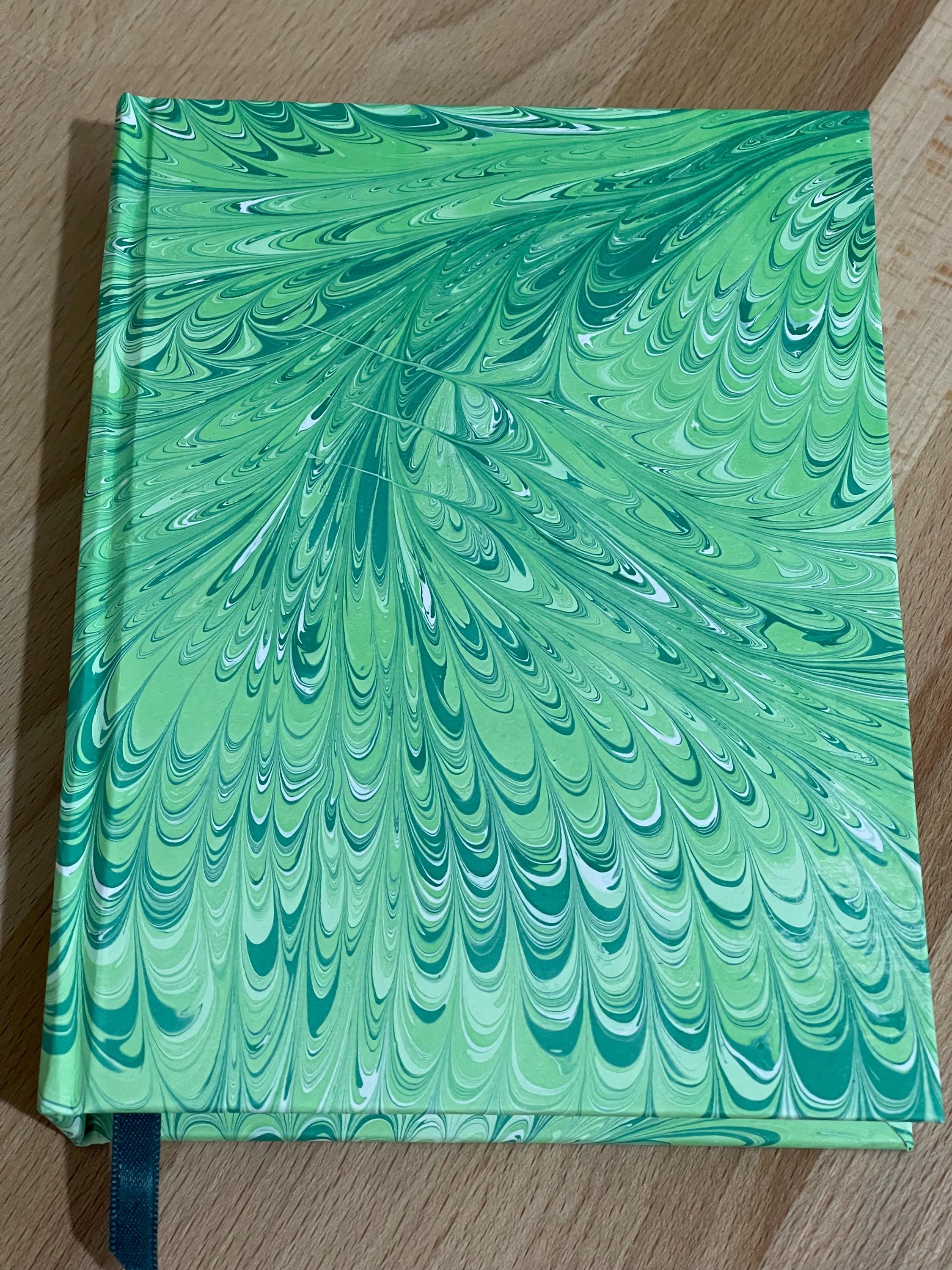 Hand marbled/painted notebook journal in a green non pareil pattern with a green book mark and recycled white lined pages