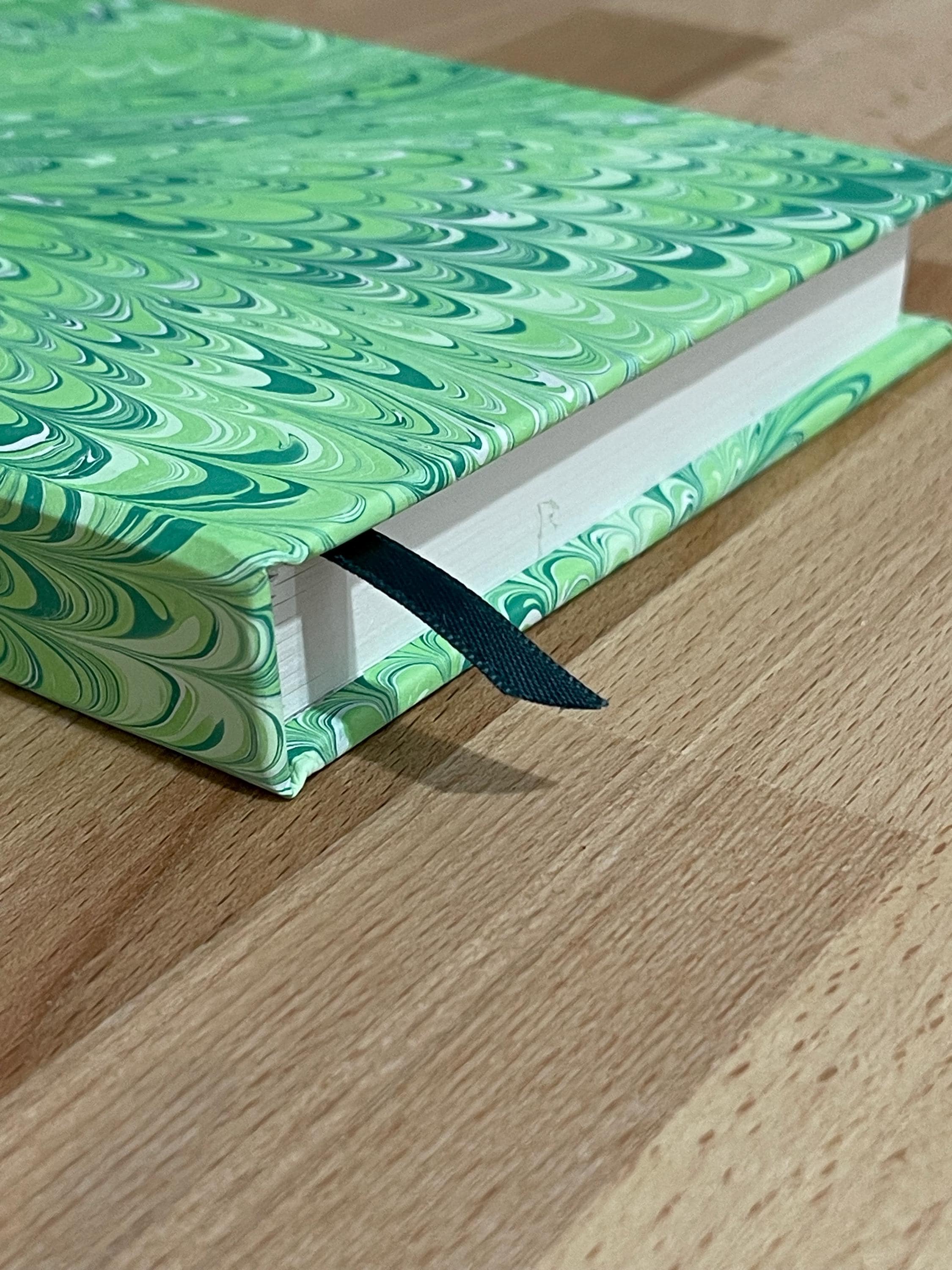 Hand marbled/painted notebook journal in a green non pareil pattern with a green book mark and recycled white lined pages