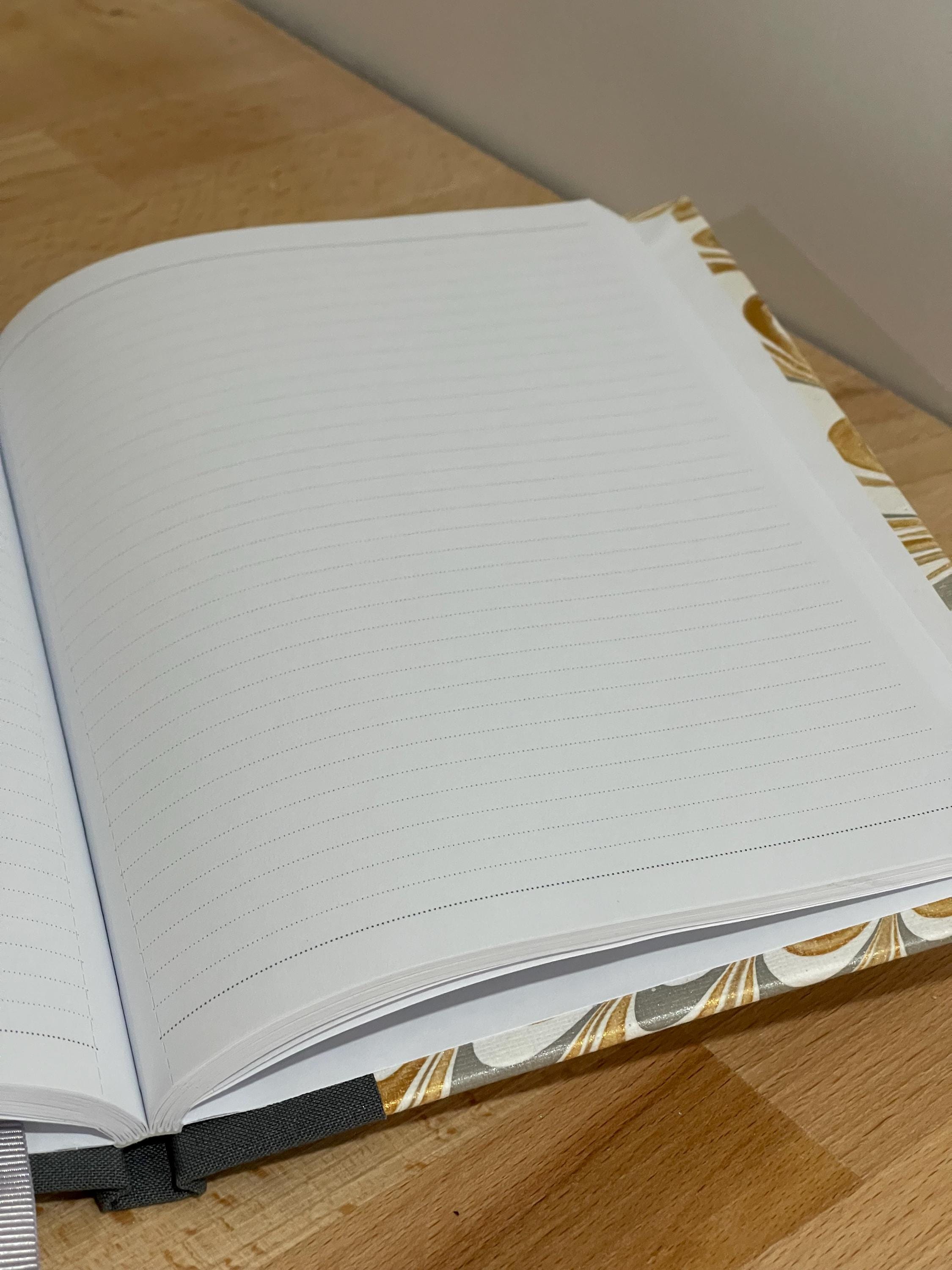 Handmade A5 Notebook /Journal with a Hand Marbled Hard Cover in gold, grey and white - lined pages