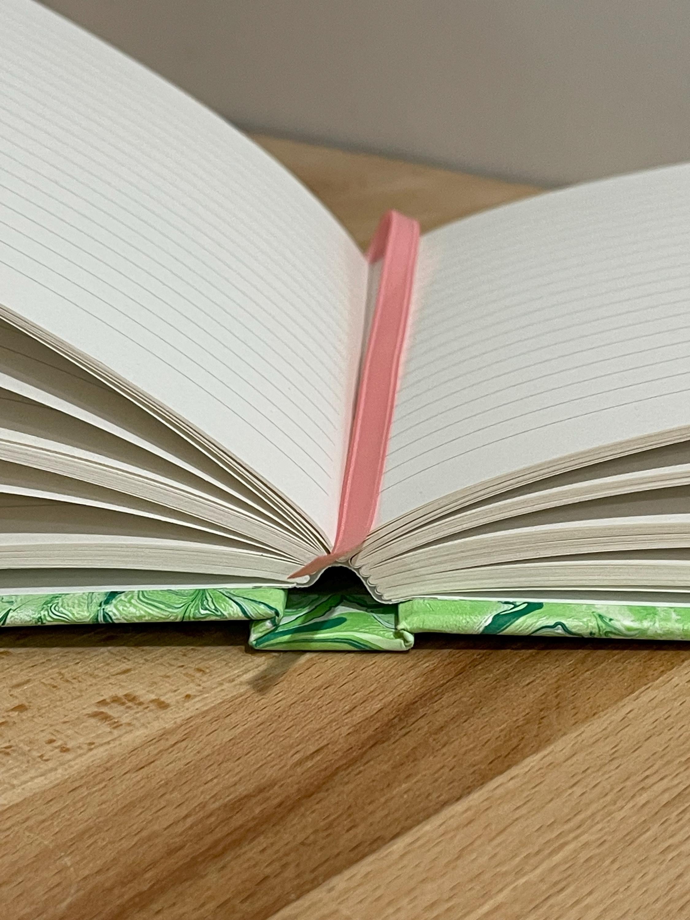 Hand marbled/painted flower notebook journal in green and pink with pink book mark and recycled white lined pages