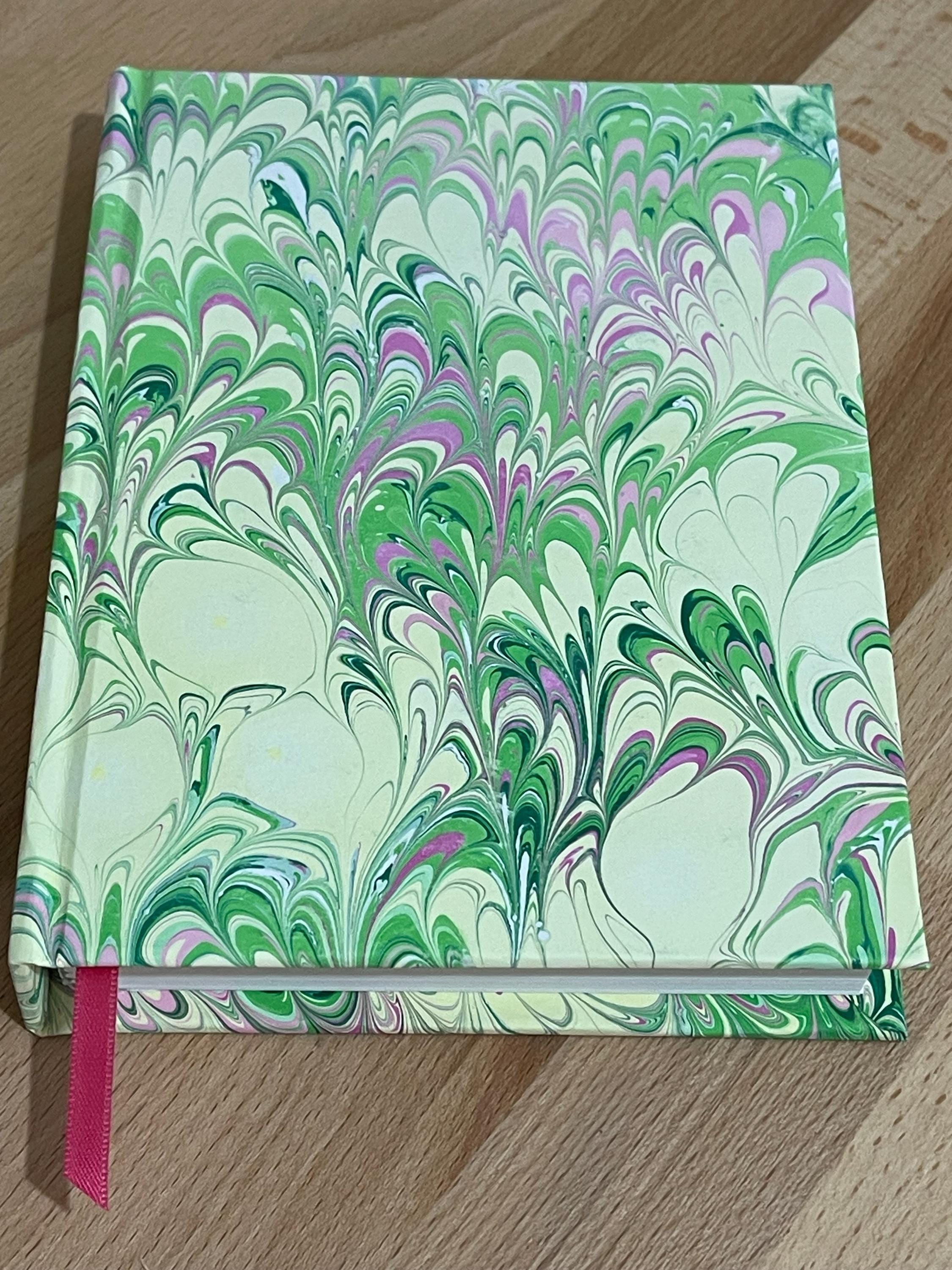 Notebook / Journal hand marbled/painted in a green, yellow and pink pattern with a pink book mark and recycled white lined pages