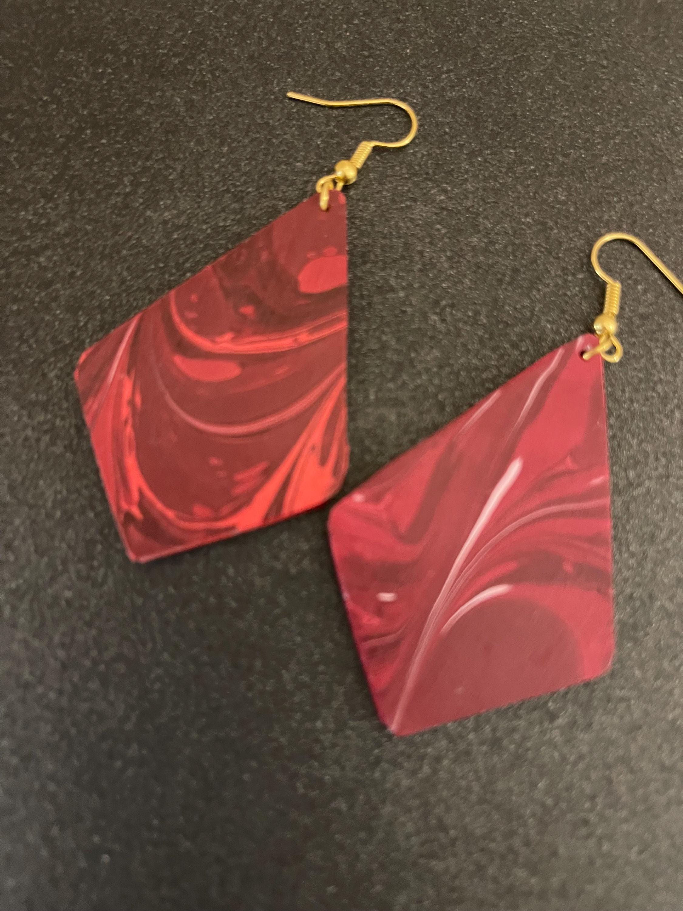 Unique diamond shape marbled dangle earrings with gold hyper allergenic hooks, fantasy pattern in deep burgundy reds with flashes of white