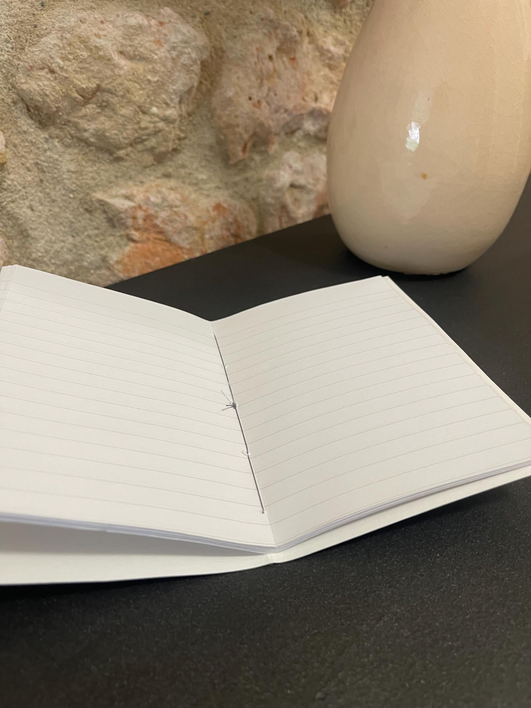 Hand sewn, hand marbled pocket notebook, A6, soft cover in greens, greys and blacks with 80 pages of lined 80g/m2 paper. Unique gift.