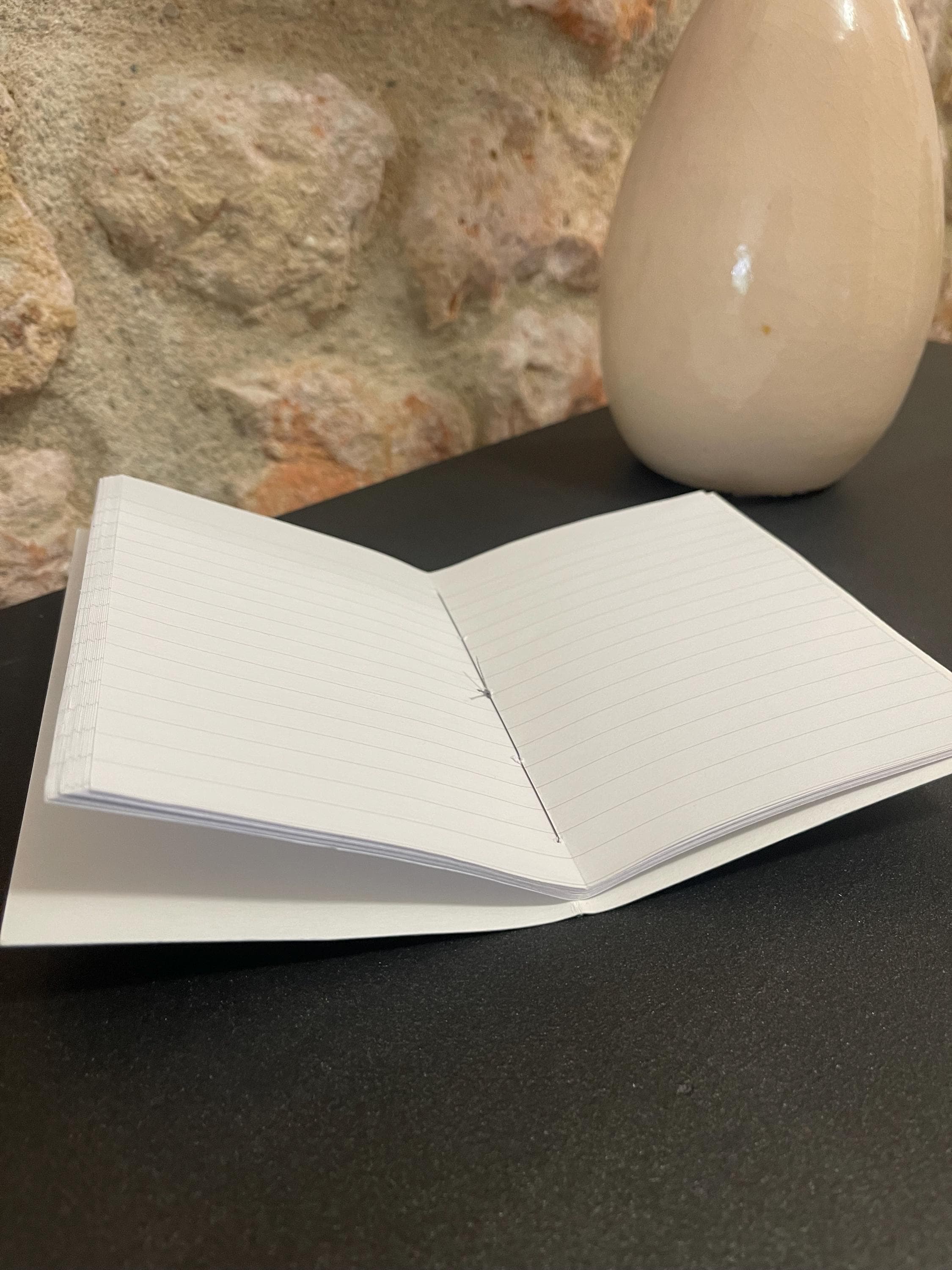 Hand sewn, hand marbled pocket notebook, A6, soft cover in greens, greys and blacks with 80 pages of lined 80g/m2 paper. Unique gift.