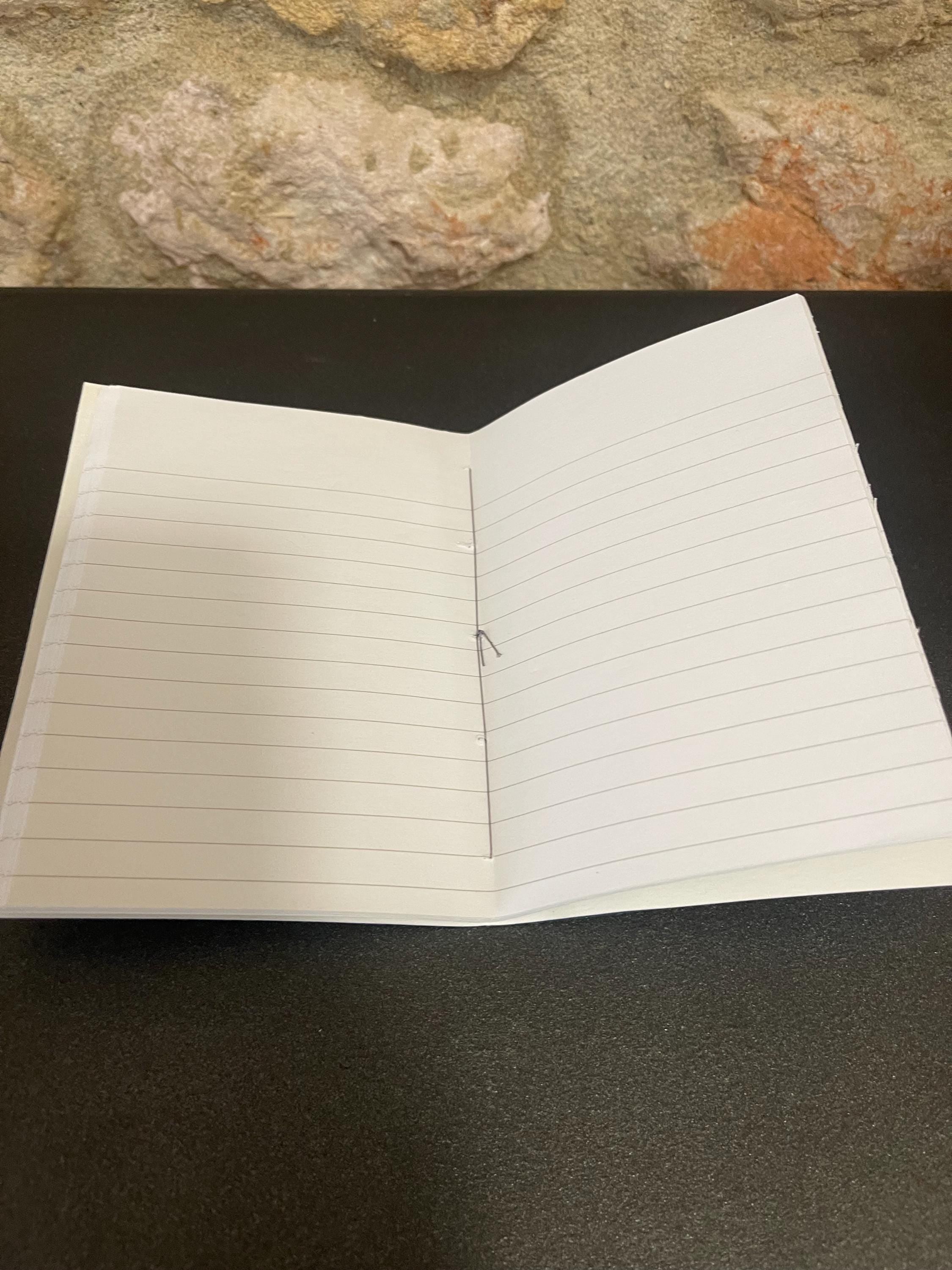Pocket lined notebook, hand sewn, hand marbled soft cover, A6, in blues, stone pattern with 80 pages of lined 80g/m2 paper. Unique gift.