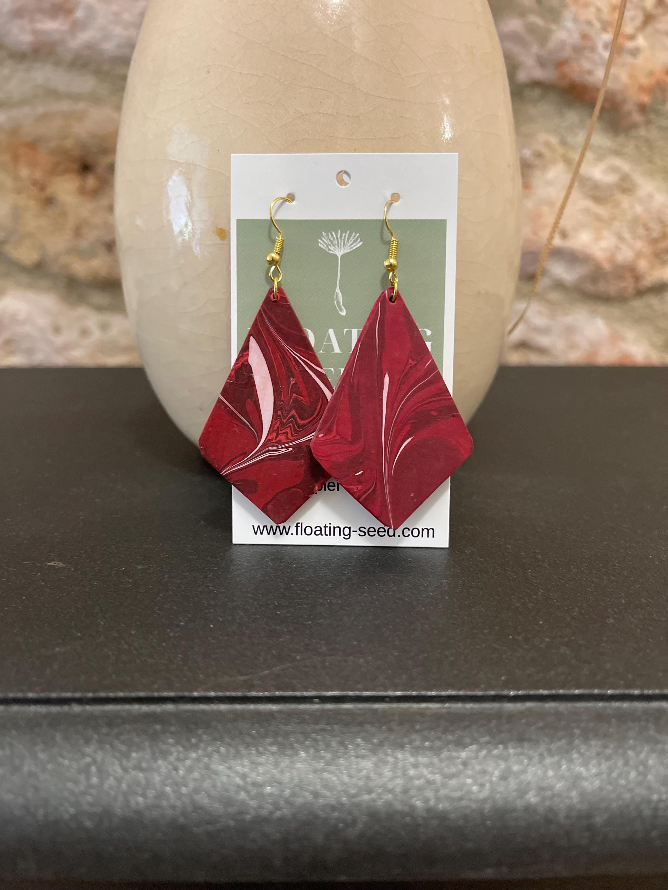 Unique diamond shape marbled dangle earrings with gold hyper allergenic hooks, fantasy pattern in deep burgundy reds with flashes of white