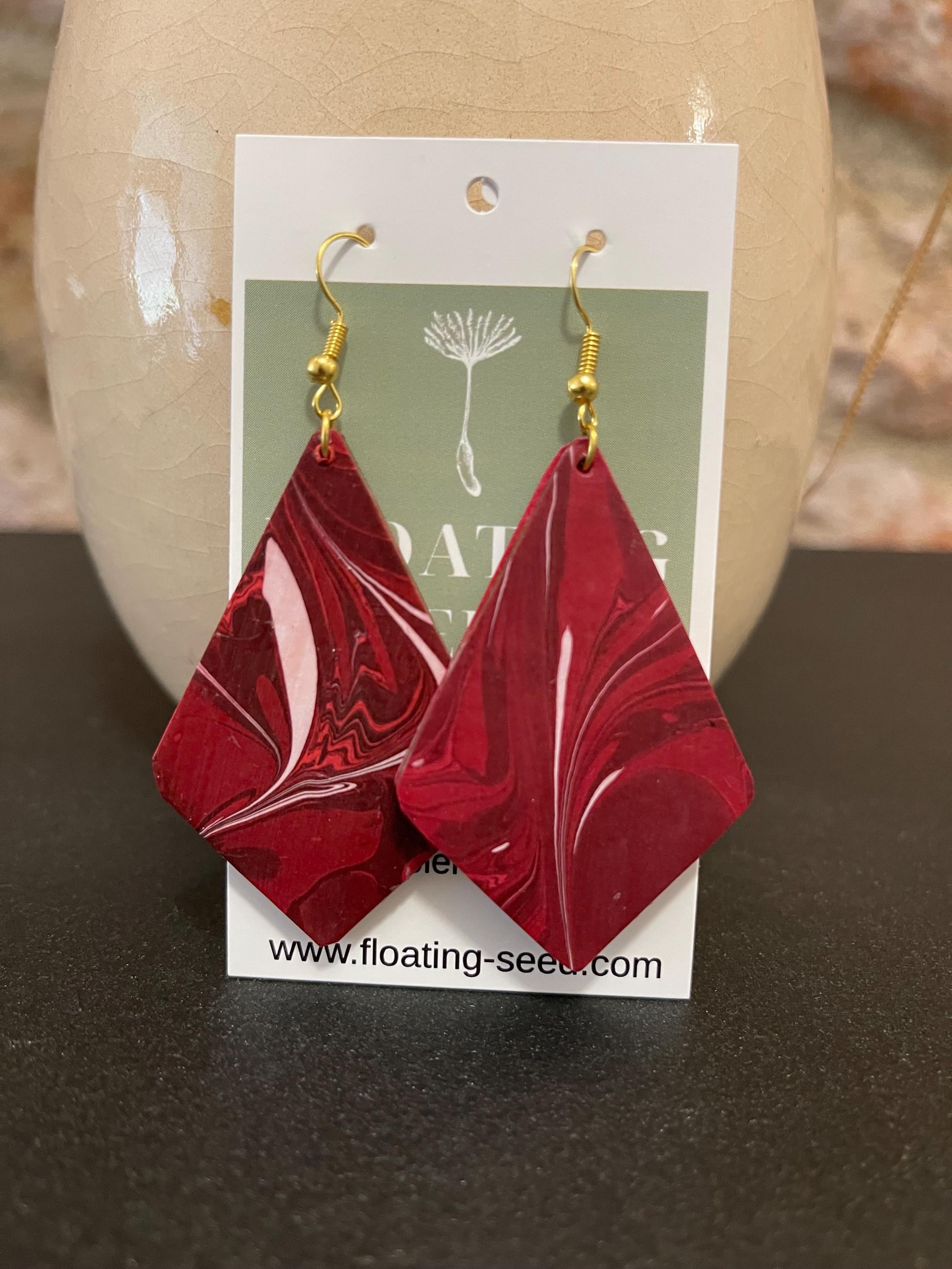 Unique diamond shape marbled dangle earrings with gold hyper allergenic hooks, fantasy pattern in deep burgundy reds with flashes of white