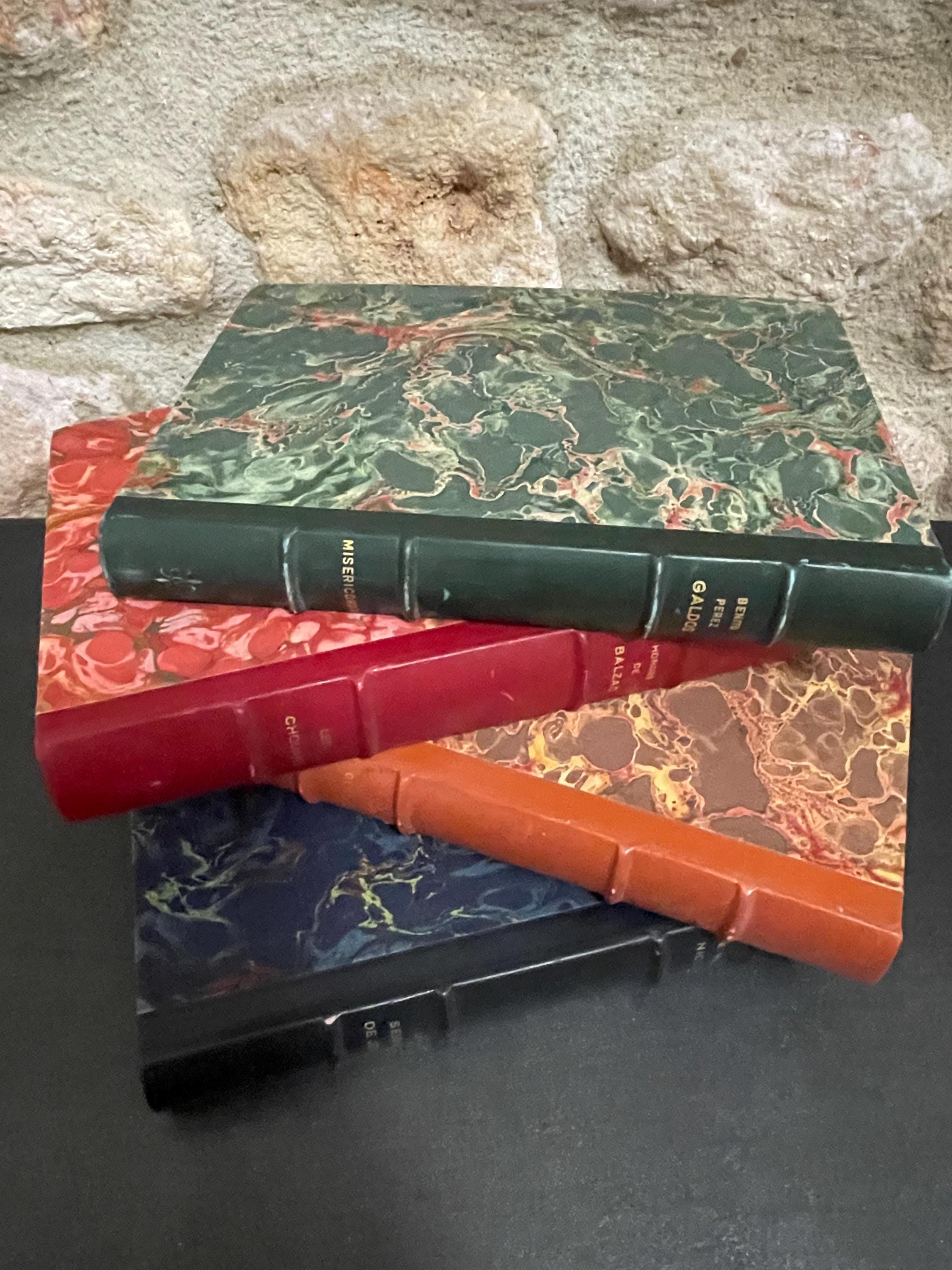 Collection of 4 colourful leather bound green, red, brown and blue marbled books from the mid 1950s France, ideal decorative pieces