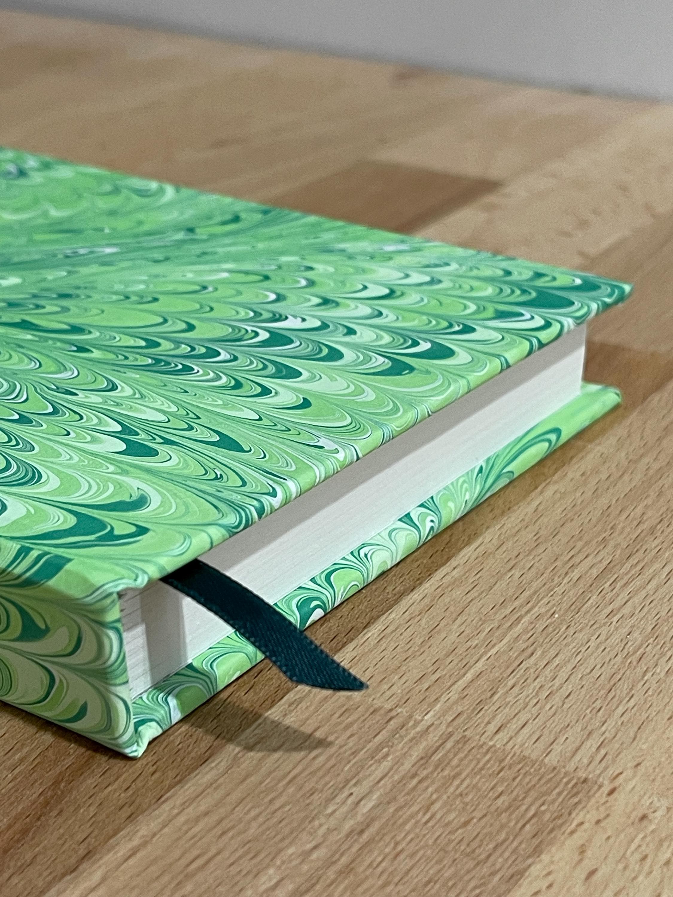 Hand marbled/painted notebook journal in a green non pareil pattern with a green book mark and recycled white lined pages