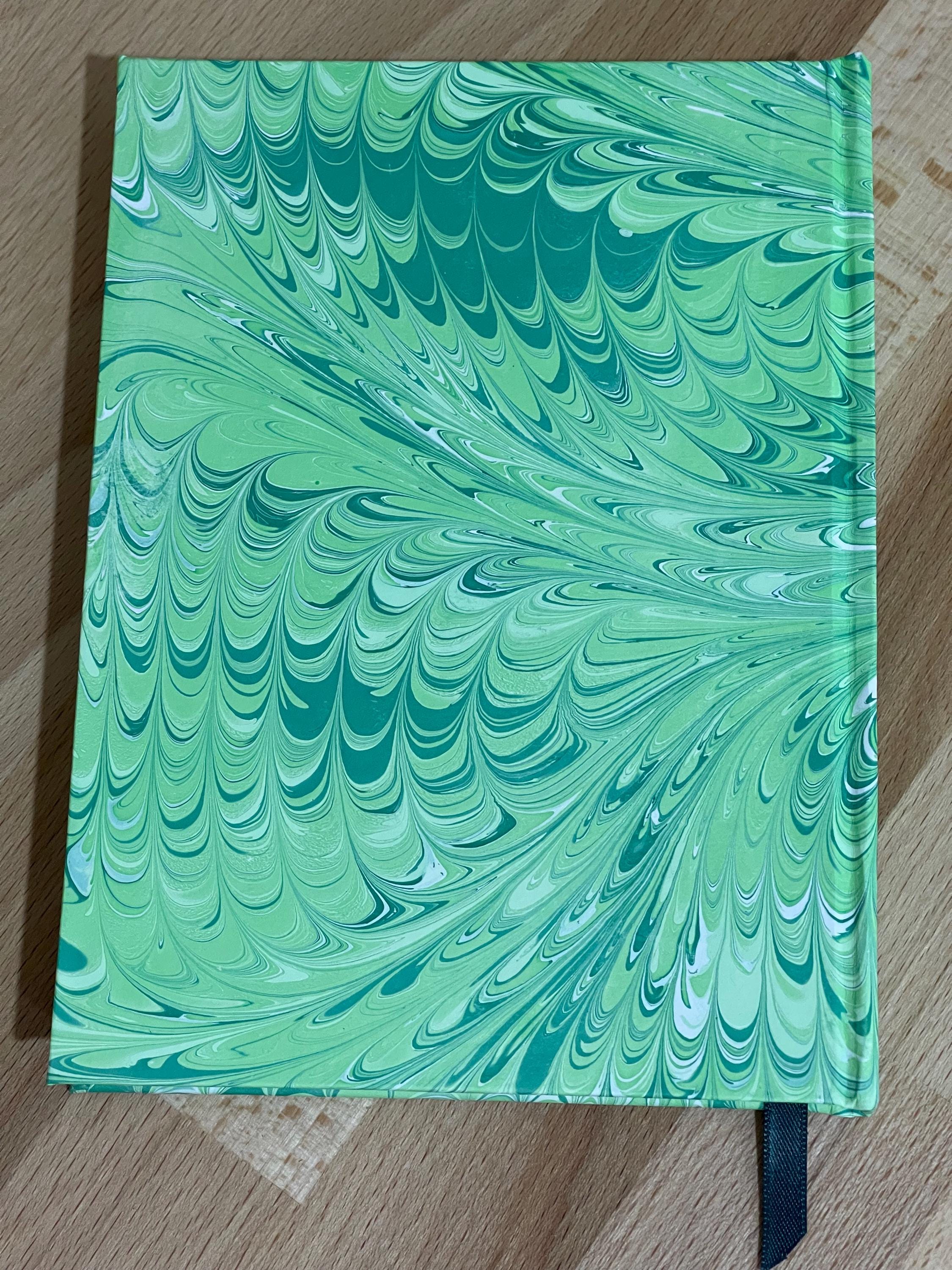 Hand marbled/painted notebook journal in a green non pareil pattern with a green book mark and recycled white lined pages