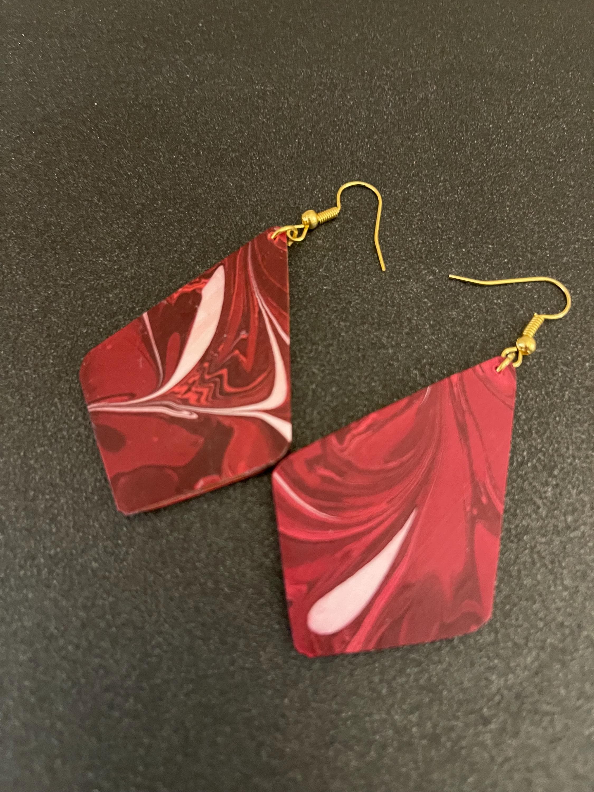 Unique diamond shape marbled dangle earrings with gold hyper allergenic hooks, fantasy pattern in deep burgundy reds with flashes of white