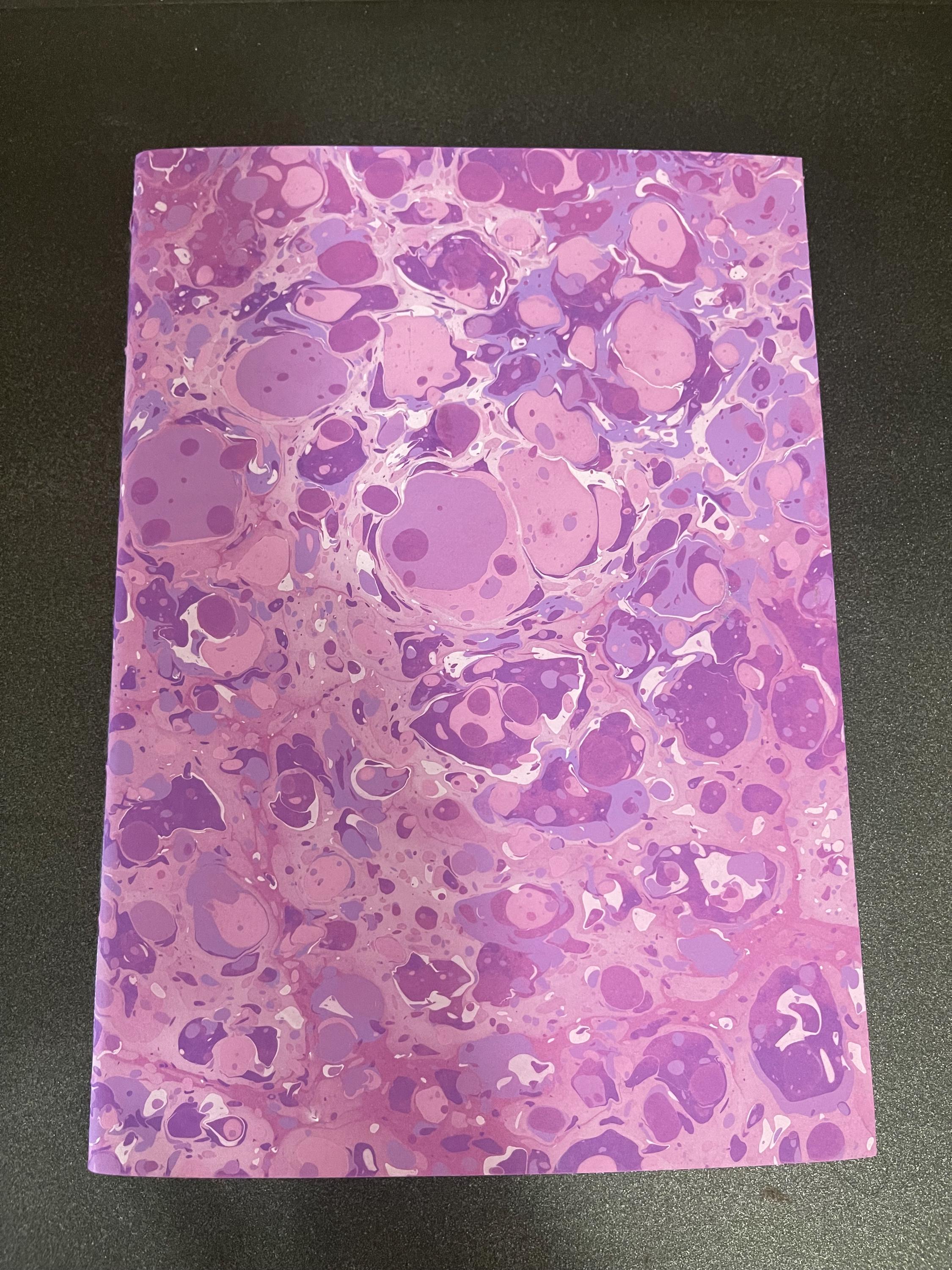 Hand sewn, hand marbled sketchbook, notebook, journal, softcover in lavender, purples w/ splashes of white with recycled white plain pages.