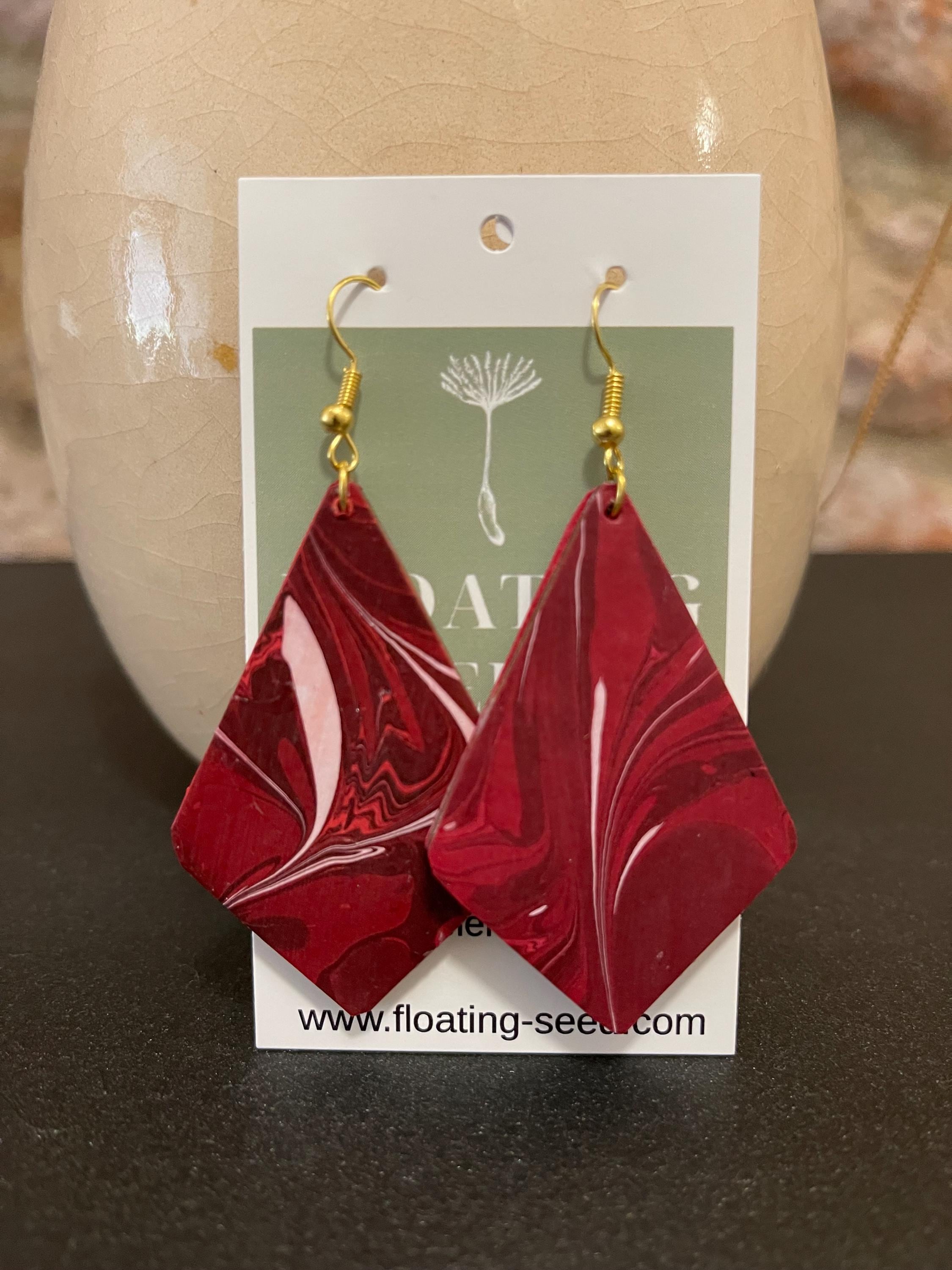 Unique diamond shape marbled dangle earrings with gold hyper allergenic hooks, fantasy pattern in deep burgundy reds with flashes of white