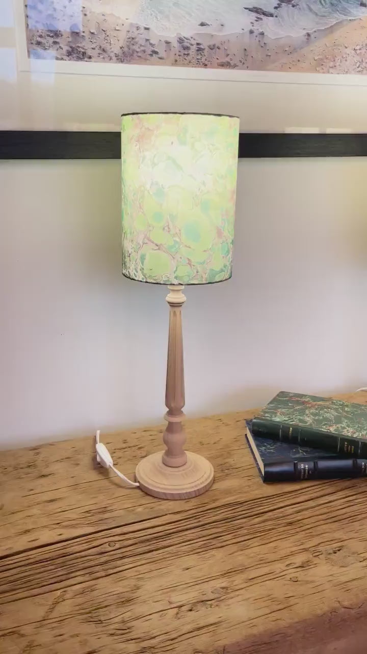 A pair of unique silk green and plum hand marbled drum table lampshades ideal as table or bedside lamps